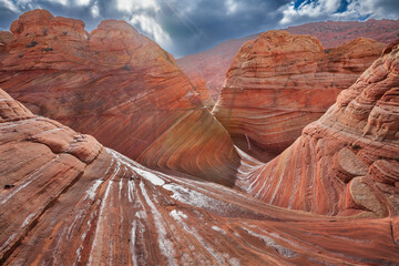 The Wave in Vermilion Cliffs, USA, showcases surreal sandstone formations with wave-like patterns...