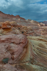 The Wave in Vermilion Cliffs, USA, showcases surreal sandstone formations with wave-like patterns...