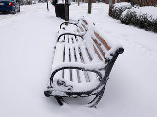 Snow-Covered Bench After Winter Storm