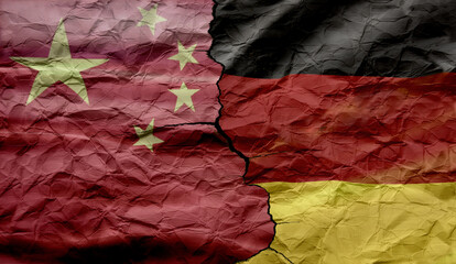 Flags of China and Germany on a cracked background. Concept of conflict between countries,...