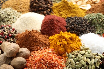 Many different spices as background, closeup view
