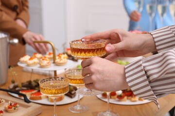 People with different appetizers at buffet, selective focus