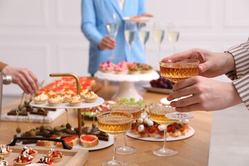 People with different appetizers at buffet, selective focus