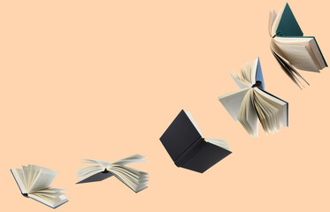 Hardcover books flying like birds against pink beige background