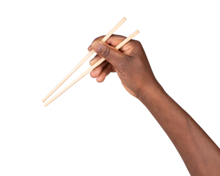 Male hand holding chopsticks ready to eat sushi, isolated on white or transparent background, top view