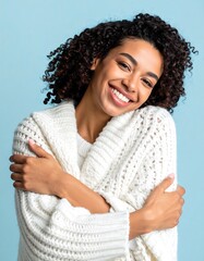 Woman Smiling and Hugging Herself in Warm Sweater