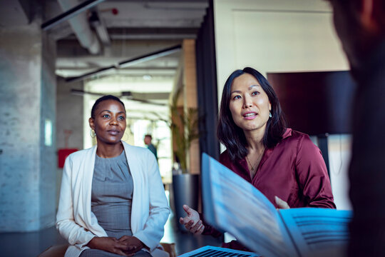 Businesswomen discussing data during office meeting