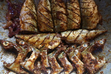 Sardine fish pieces in a dish ready to fry	