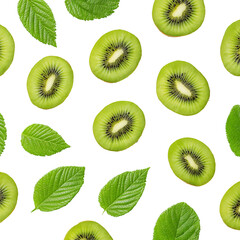 Fototapeta premium Fresh kiwi slices with green leaves scattered against a bright background, offering a vibrant and healthy composition