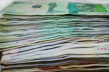 Stack of Colombian pesos bills background