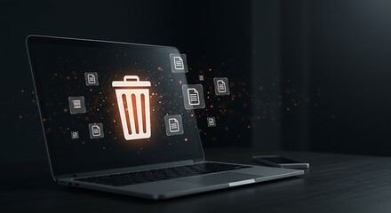 Laptop displaying digital trash bin and files delete