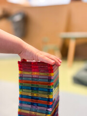 Naklejka premium baby hand holding magnet toys