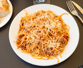 Healthy plate of Italian spaghetti topped with ground beef Bolognese sauce