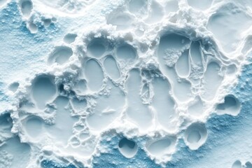 Obraz premium The aerial view of snow and water, melting together in a captivating, textured landscape with ice, soft light and shadows.