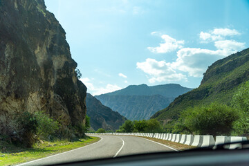 A road with a mountain in the background