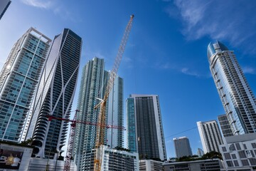 Fototapeta premium building foundation construction site with tall buildings in the background
