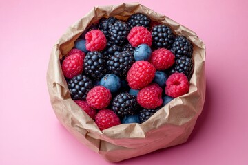 Overhead Shot of a Paper Sack Overflowing with Fresh Raspberries, Blackberries, and Blueberries