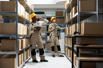 African american employee in logistics facility manages product delivery, quality control for...