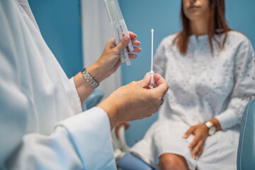 Unrecognizable woman at gynecologist , having vaginal smear test 