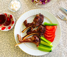 Grilled lamb mutton meat chops steaks on a cutting board. Top view