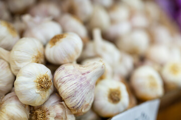 Garlic in a crate, put up for sale in a store. Close-up image