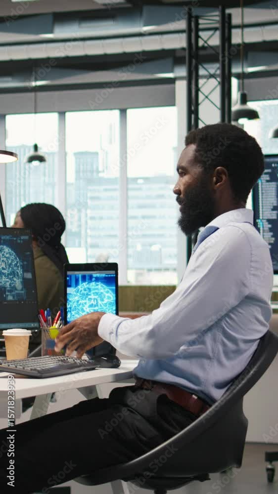 Poster vertical video admin in office relies on ai machine learning to run tasks across multiple devices, m
