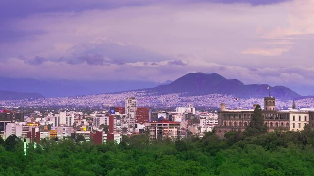 Chapultepec Castle and Iztaccihuatl Volcano Seen from Mexico City with Cloudy Sky in Mexico City. 