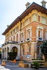 Fototapeta premium View of Gargnano signpost by Lake Garda, Italy; ideal for travel and destination visuals.