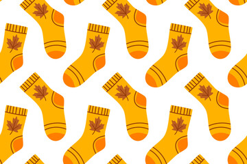Seamless pattern with orange socks decorated with autumn leaves. Cozy fall-themed design for seasonal projects.