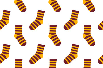Seamless pattern with striped brown and orange socks. Warm color palette for autumn and cozy clothing themes.