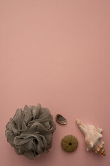 grey recyclable shower or bath sponge with seashells