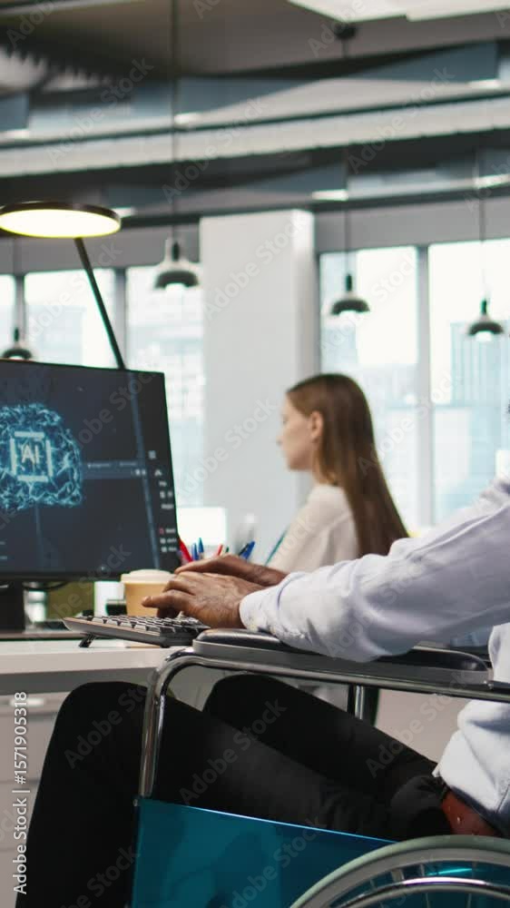 Fototapete Vertical video Computer scientist with paraplegia in office automating repetitive tasks with AI scripts. IT professional in wheelchair using artificial intelligence to speed up feature implementation