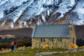 Unrecognisable lovers at the famous church of the good shepherd at Lake Tekapo