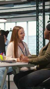 Vertical video Colleagues bonding at work, sharing personal issues during break, reassuring each other. Coworkers forging the strongest friendships in office, sharing problems and supporting each
