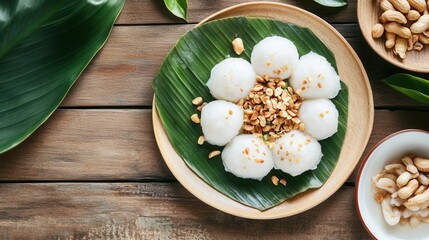 Banh ram it, a traditional vietnamese dish, is served on a banana leaf with peanut topping