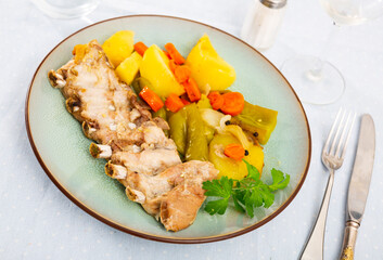 Stewed rack of pork with potato and vegetables, healthy dinner