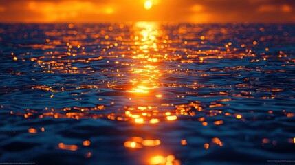 Golden sunset reflecting on rippling water