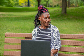 Professional African American Woman Working on Laptop in Park Setting