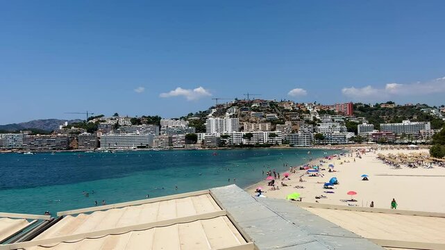 Mallorca, Spain - July 7, 2025: Spanien Mallorca Strand Kuste Bucht Santa Ponsa. Sailboat and coastline. Santa Ponsa Beach Calvia Mallorca. beach and hotels, Balearic Islands, Mediterranean, Europe 