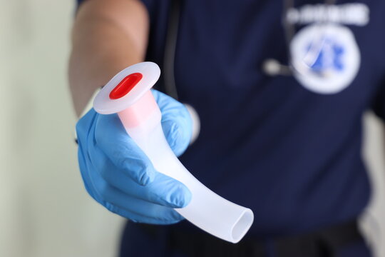 Oral airways in a paramedic woman hands holding close to the camera