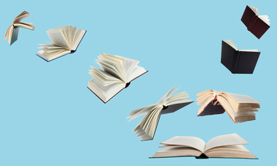 Hardcover books flying like birds against light blue background