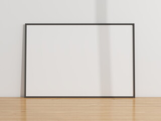 Horizontal frame mockup on a wooden table and white wall. 3D rendering, interior design, 3D...