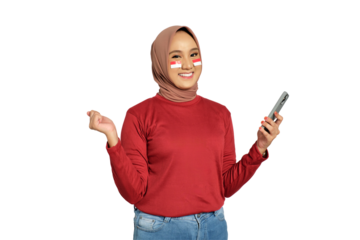 Excited young Asian women celebrate Indonesian independence day on 17 August while holding mobile phone isolated on transparent background