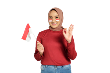 Happy young Asian women celebrate Indonesian independence day on 17 August by holding the Indonesian flag and doing ok sign isolated on transparent background