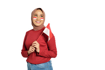 Happy young Asian women celebrate Indonesian independence day on 17 August by holding the Indonesian flag isolated on transparent background