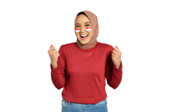 Excited young Asian women celebrate Indonesian independence day on 17 August by raising fists isolated on transparent background