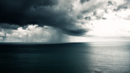 Fototapeta premium Dramatic swirling cloud formation over the ocean from an elevated perspective. 