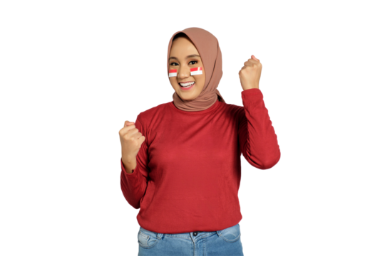 Excited young Asian women celebrate Indonesian independence day on 17 August by raising fists isolated on transparent background