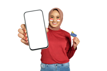 Smiling young Asian women celebrate Indonesian independence day on 17 August while holding smartphone with blank screen and credit card isolated on transparent background