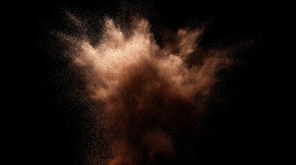 Dynamic brown powder suspended in mid-air against a deep black background, capturing movement.
